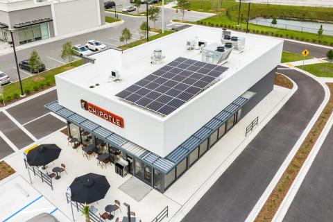 Chipotle’s new sustainable restaurant design includes rooftop solar panels.